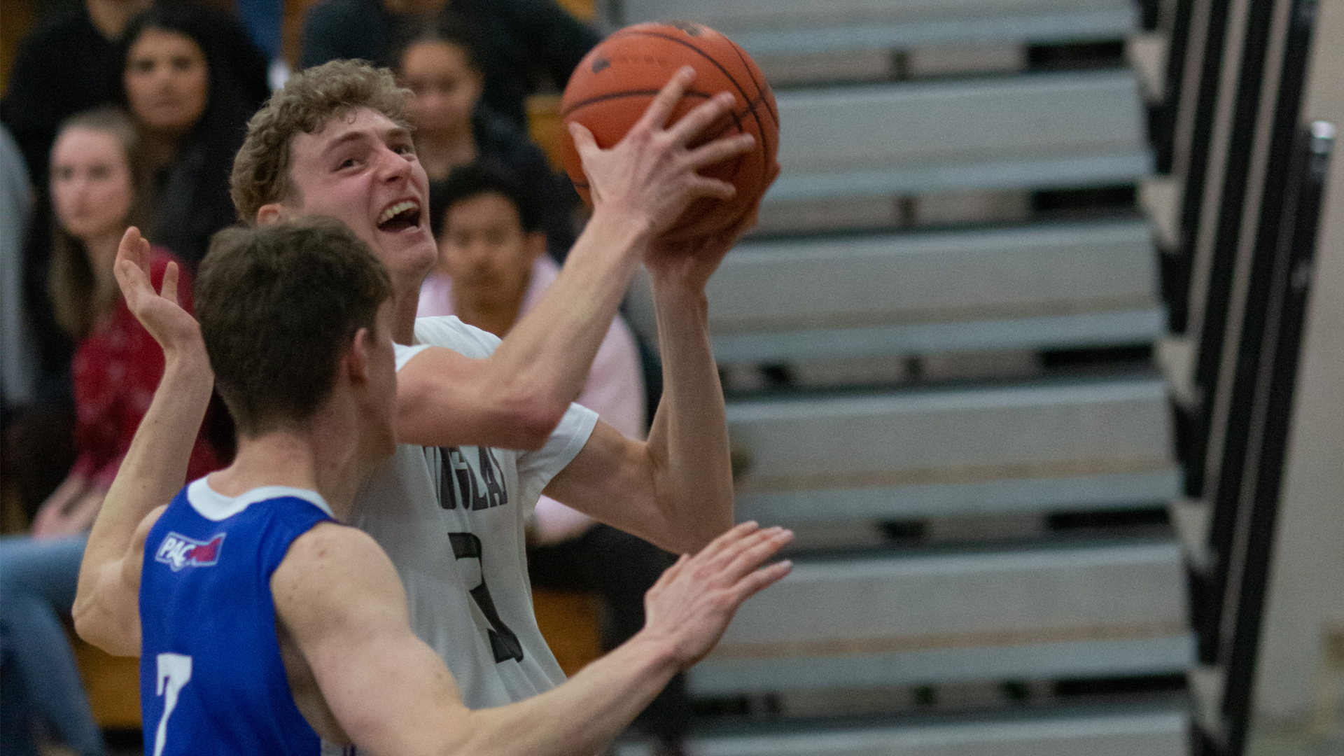 Cam Morris drives to the hoop against a Capilano defender